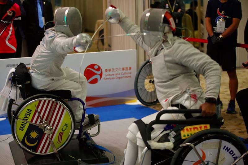 Vibhas Sen seen here wearing the GOQii band and competing with the Malaysian wheelchair Fencer at the Asian Championship in Hong Kong