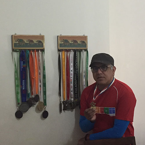 Jitu Arora with several of his Marathon medals